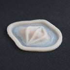 Nose Bridge Ridges - Silicone makeup prosthetic in vanilla shade on a black surface