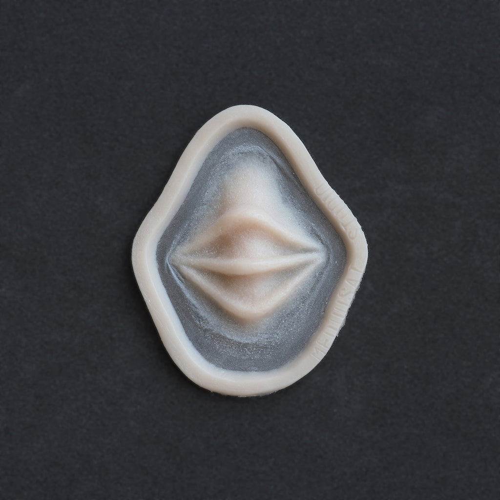 Nose Bridge Ridges - Silicone makeup prosthetic in vanilla shade on a black surface