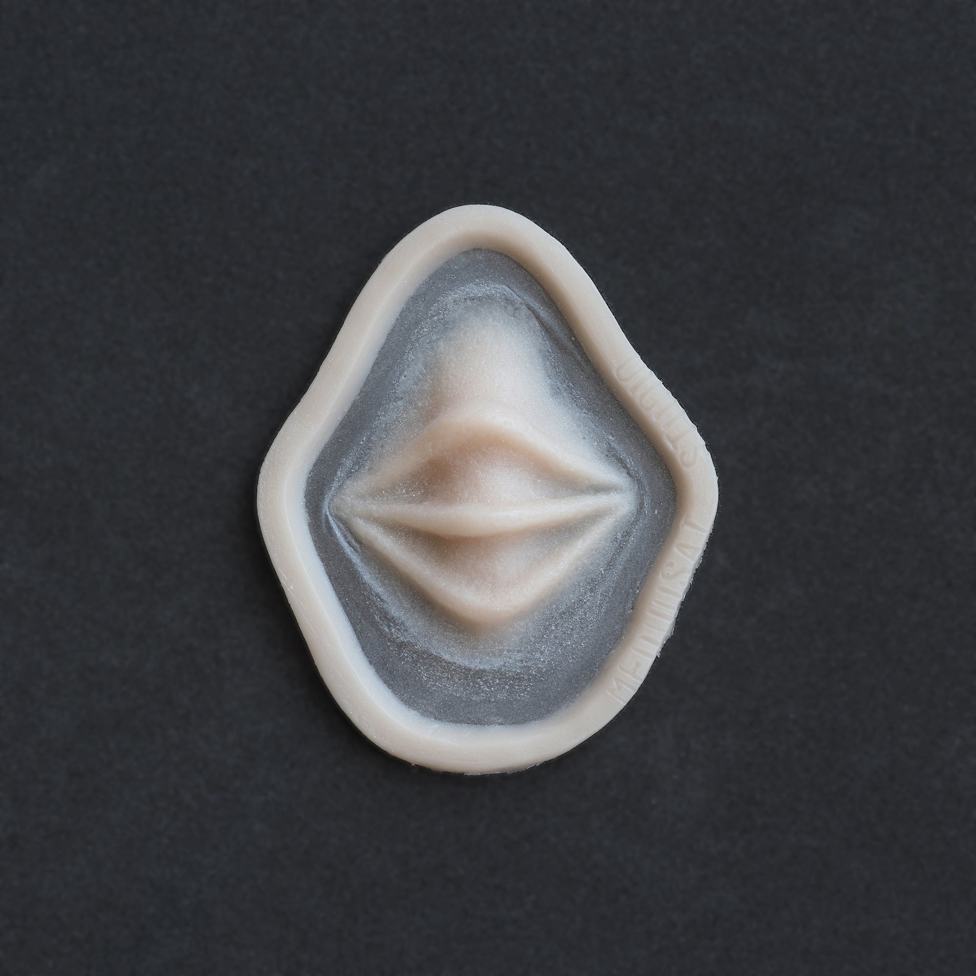 Nose Bridge Ridges - Silicone makeup prosthetic in vanilla shade on a black surface