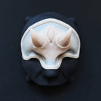 Oni Brow silicone prosthetic in vanilla shade on a black surface