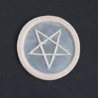 Pentagram Scarification - Silicone makeup prosthetic in vanilla shade on a black surface