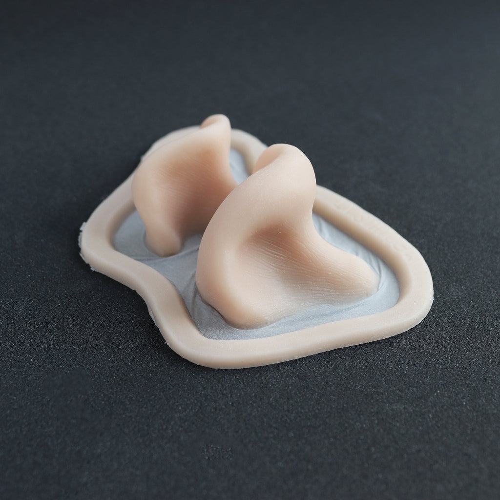 Resinous Polypore Mushrooms - Silicone makeup prosthetic in vanilla shade on a black surface