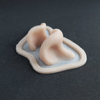 Resinous Polypore Mushrooms - Silicone makeup prosthetic in vanilla shade on a black surface