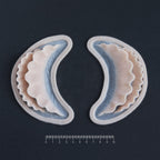 Ruffle Gills (Pair) - Silicone makeup prosthetic in vanilla shade on a black surface with a ruler