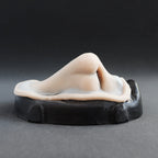 Satyr Nose - Silicone makeup prosthetic in vanilla shade on a black surface