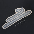 Scarification Strips - Silicone makeup prosthetic in vanilla shade on a black surface with a ruler