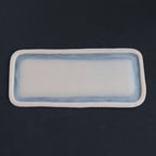 Long Silicone Patch - Silicone makeup prosthetic in vanilla shade on a black surface