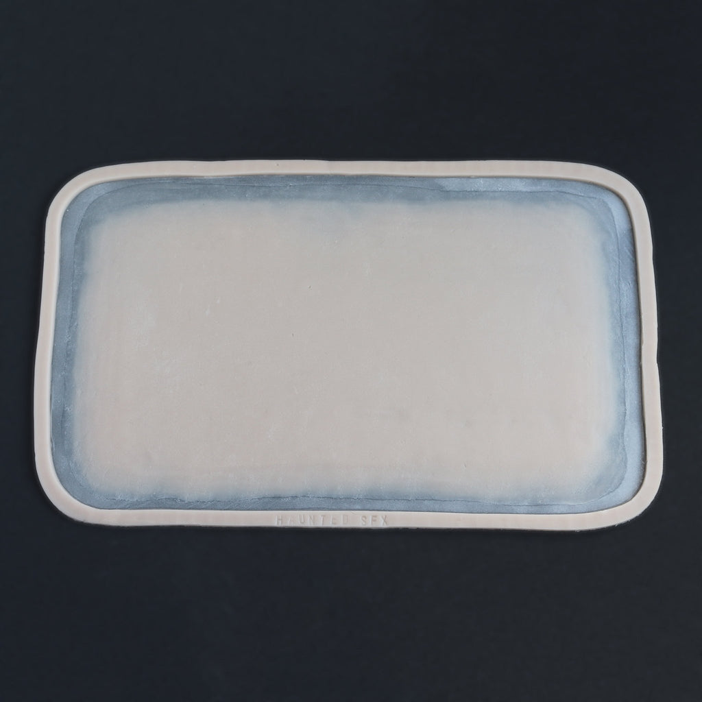 Regular Silicone Patch - Silicone makeup prosthetic in vanilla shade on a black surface