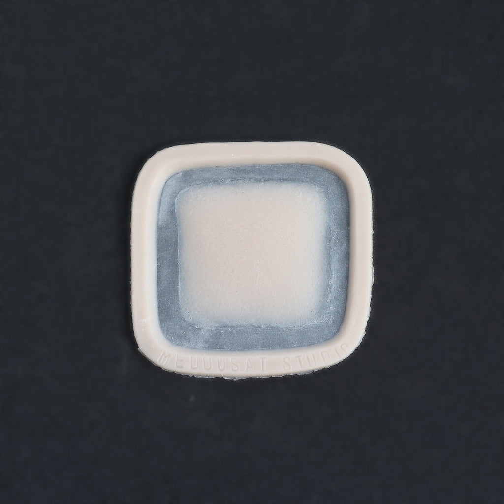 Mini Silicone Patch - Silicone makeup prosthetic in vanilla shade on a black surface