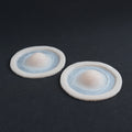 Single Subdermal Horns (Pair) - Silicone makeup prosthetic in vanilla shade on a black surface