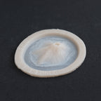 Skin Pocket 2 - Silicone makeup prosthetic in vanilla shade on a black surface