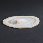 Skin Pocket 1 - Silicone makeup prosthetic in vanilla shade on a black surface