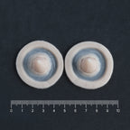 Small Devil Horns (Pair) - Silicone makeup prosthetic in vanilla shade on a black surface with a ruler