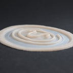 Stargate Goa'uld Mark - Silicone makeup prosthetic in vanilla shade on a black surface