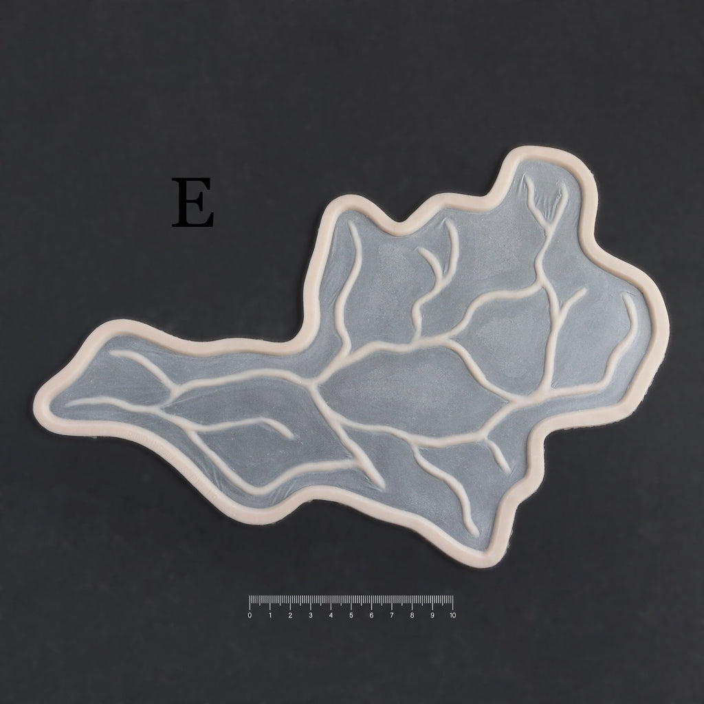 Superficial Cranial Veins E - Silicone makeup prosthetic in vanilla shade on a black surface with a ruler