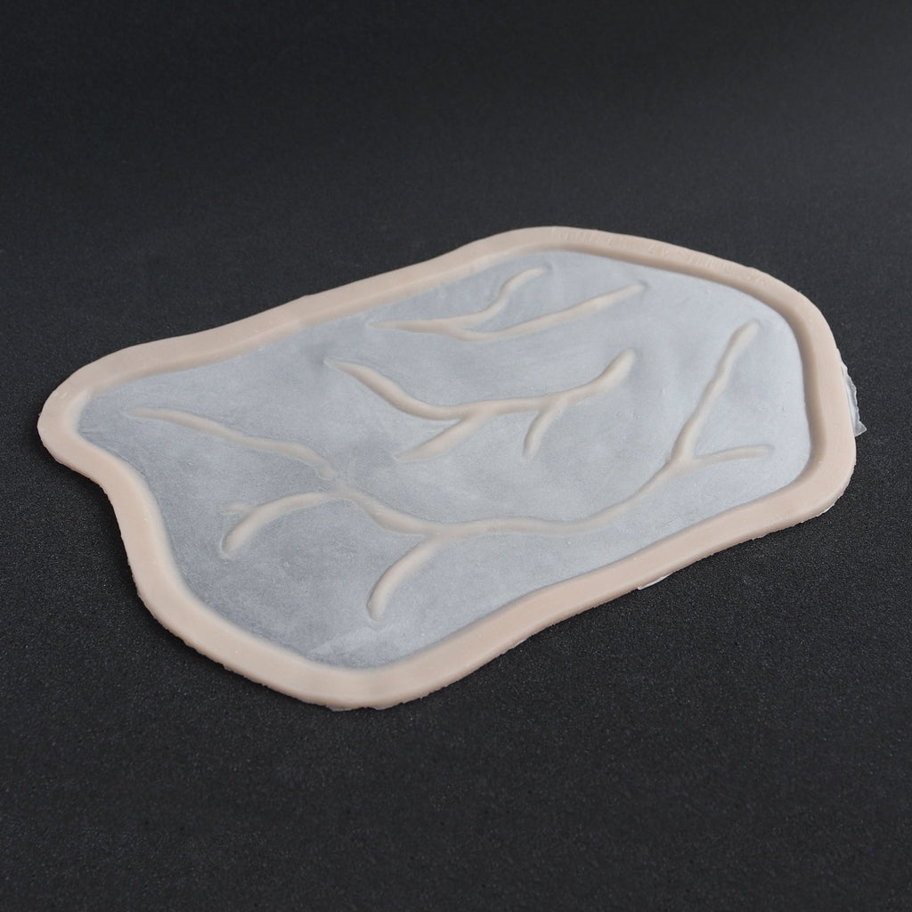 Superficial Cranial Veins - Silicone makeup prosthetic in vanilla shade on a black surface
