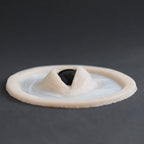 Third Eye - Silicone makeup prosthetic in vanilla shade on a black surface