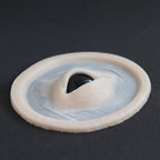 Third Eye - Silicone makeup prosthetic in vanilla shade on a black surface