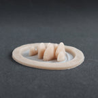 Vertical Bracket Fungi - Silicone makeup prosthetic in vanilla shade on a black surface