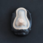 Wooden Nose - Silicone makeup prosthetic in vanilla shade on a black surface